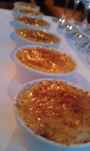 Five rice pudding brulees in white ramekins